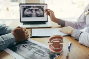 Dental implants and dentures compared at Advanced Dental Center in Louisville, Kentucky
